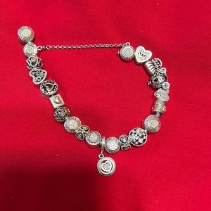 Pandora two toned bracelet with 18 charms and safety chain